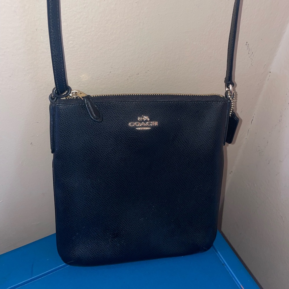 Black leather coach crossbody bag